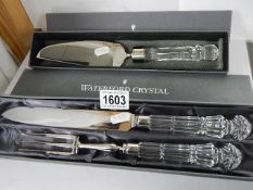 A boxed Waterford crystal carving set and cake slice,