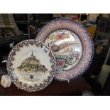 A Limoges 'Mont Saint Michel' plate and a large hand painted Portuguese plate