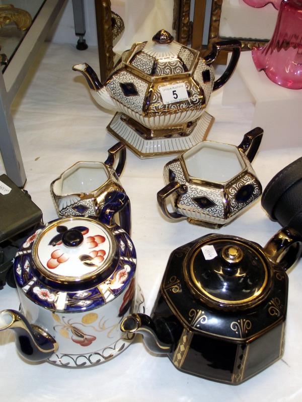A Britannia pottery Burslem tea set and 2 other tea pots