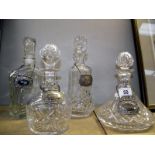 3 cut glass decanters and 1 other with silver plated labels