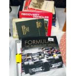 A selection of hardback books, including Formula 1, Top Gear, Atlas, etc