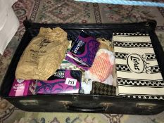 An old case of vintage sewing/tapestry/craft items