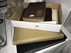 A selection of old photograph albums and loose photos