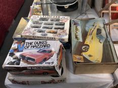 A selection of model kits, some used and boxes are tatty