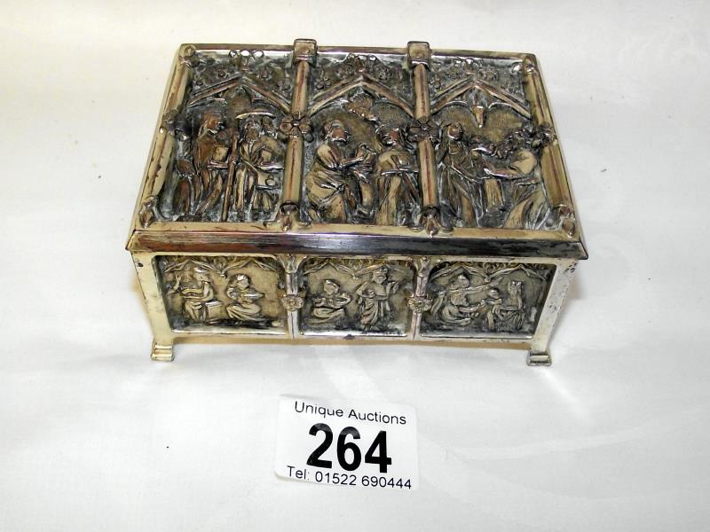 An unusual embossed silver plate box with church design patterns on all sides