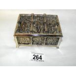 An unusual embossed silver plate box with church design patterns on all sides