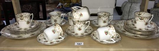 A 28 piece vintage tea set decorated with roses