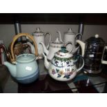 A quantity of tea pots and coffee pots