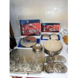 A selection of Cavalier silver plated place mats and coasters includes 2 boxed sets