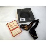 A cased Meerschaum pipe, slate ashtray and Park Drive playing cards