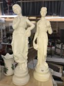 A pair of tall classical figures, height 66cm, 1 has chip to urn, COLLECT ONLY