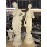 A pair of tall classical figures, height 66cm, 1 has chip to urn, COLLECT ONLY