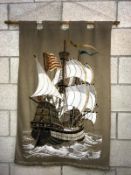 A large framed tapestry of a galleon sailing ship, 78cm x 120cm, COLLECT ONLY