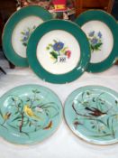 2 hand painted cabinet plates decorated with birds and 3 floral decorated plates