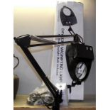 A boxed daylight magnifying lamp