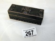 An enamel small oblong trinket box, with velvet inner