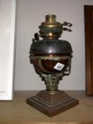 A Victorian brass Corinthian oil lamp