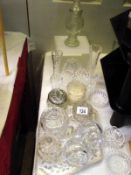 A nice lot of cut glass posy flower vases, candle holders etc, plus a dressing table set