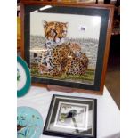 A framed and glazed tapestry of a leopard and a small one of a black cat, 48cm x 48cm and 24cm x