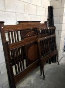 An Edwardian inlaid mahogany 5ft bed and a 3ft bed frame, both with irons, both need attention,