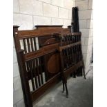 An Edwardian inlaid mahogany 5ft bed and a 3ft bed frame, both with irons, both need attention,