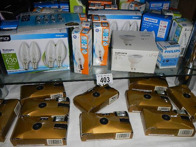 A selection of disposable camera's and light bulbs.