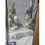 Two Spanish Lladro style figures.