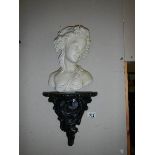 A bust of a young girl on a French style wall bracket. COLLECT ONLY.