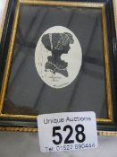 A framed and glaze silhouette entitled Lydia 1800, signed.