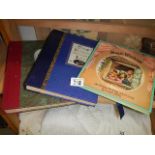 Two photo albums and another book.