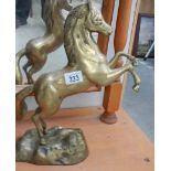 A heavy brass rearing horse.