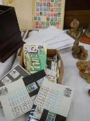 A selection of stamp albums and stamps.