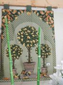 A wall tapestry entitled 'French Topiary', Approximately 66 x 91 cm.