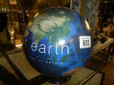A BBC Earth "Planet Earth" globe, 21cm high.