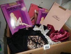 A box of ladies underwear and tights, some new.