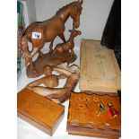 A mixed lot of wooden items including horse group, stylised figure, boxes etc.,