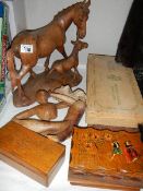 A mixed lot of wooden items including horse group, stylised figure, boxes etc.,
