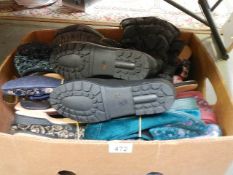 20 pairs of new slippers (sizes 3 & 4 mostly) and a pair of new size 5 boots.