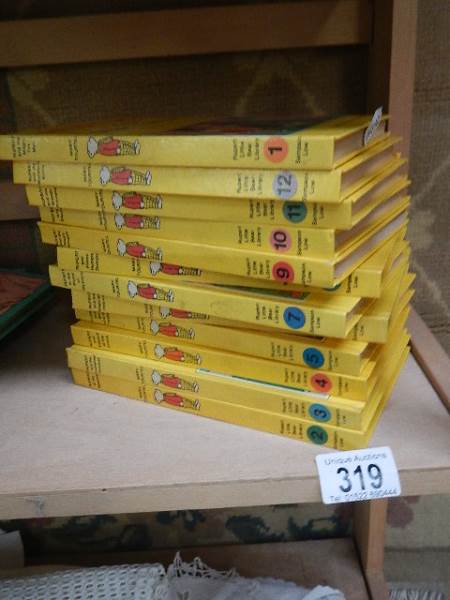 Twelve volumes of The Rupert Little Bear Library.