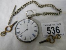 A silver pocket watch (wound to maximum so not working).
