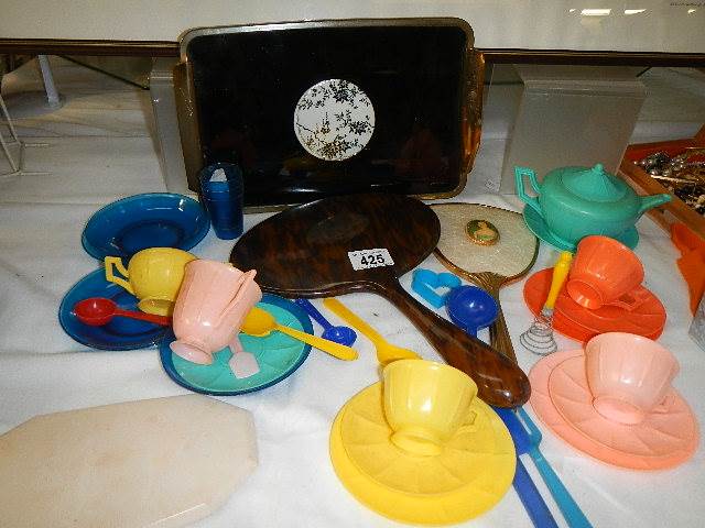 A 1970's child's plastic tea set, two dressing table mirrors and a tray.