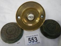 A brass bell push and two other items.