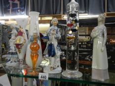 A mixed lot of ceramic figures and glass vases.