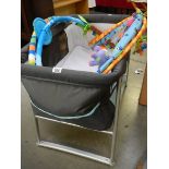 A babies travel cot with toys. COLLECT ONLY.