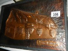 A pressed copper cottage plaque entitled Chrome Cottage.