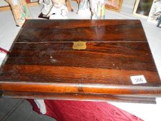 A rosewood cutlery box.