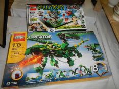 Two Lego sealed box sets: No,21205 Fusion Battle Towers and No.4894 Mythical Creatures.