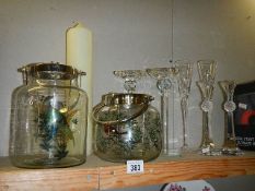 A large pillar candle and a selection of candleholders etc.,