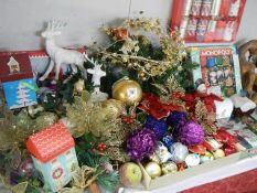 A good lot of Christmas Decorations, Monopoly crackers etc.,