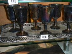 Six silver plate goblets on tray.